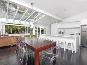 The new kitchen, wall removed to make it open plan, 3 meter long Island with stone bench and bench seating for six